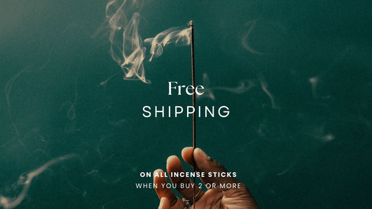 Incense stick lit with smoke smoldering. Acquired Taste Incense offers free shipping