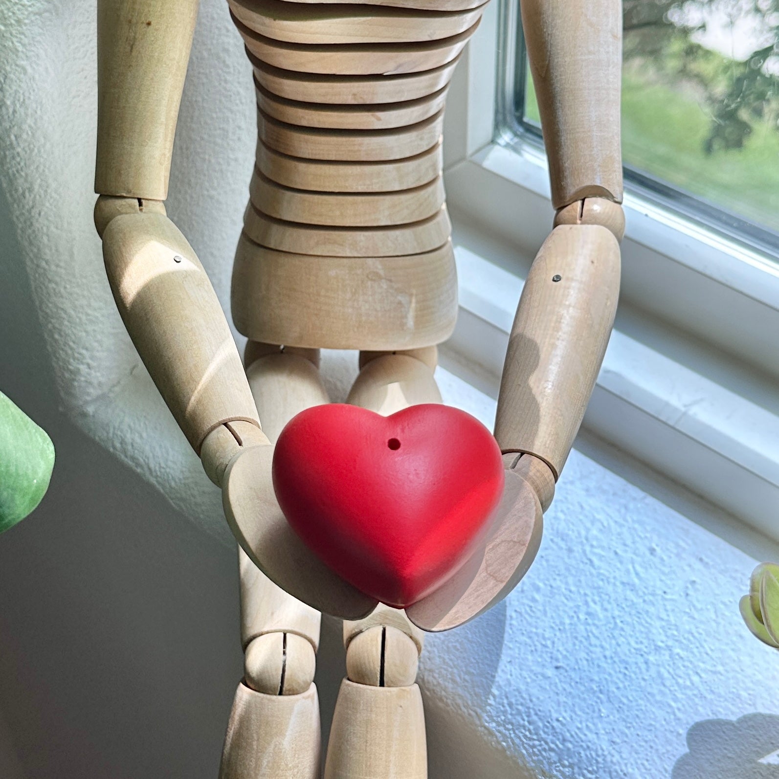 Toy holding a Heart incense stick holder