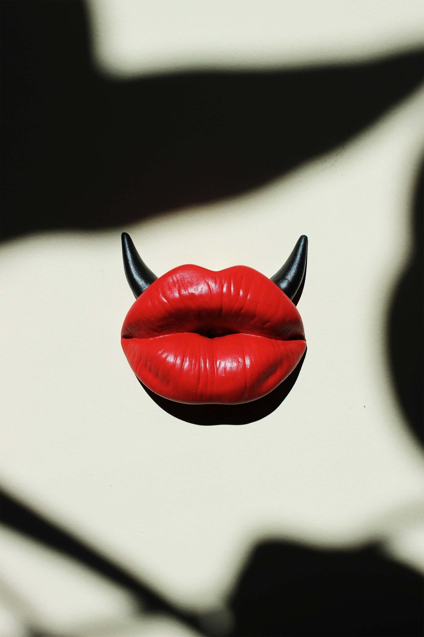 Red lips incense stick holder with black horns