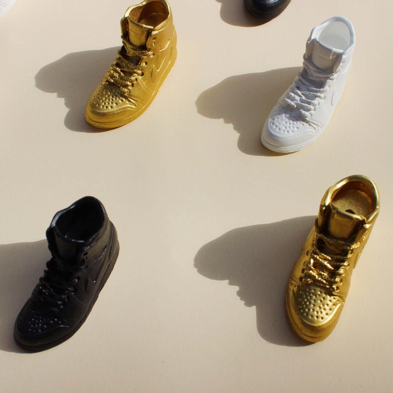 Acquired Taste Incense Stick holders Incense stick holders in the shape of sneakers in gold, black, and white
