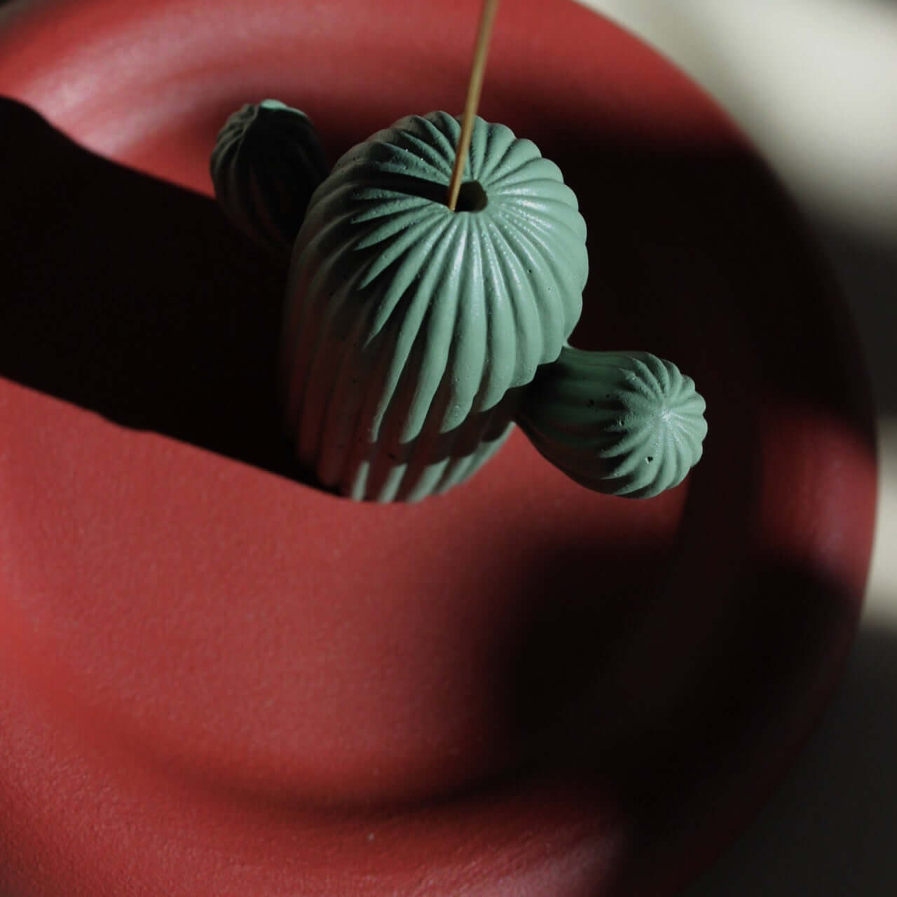 Cactus Charm incense stick holder up close in use with incense stick photo