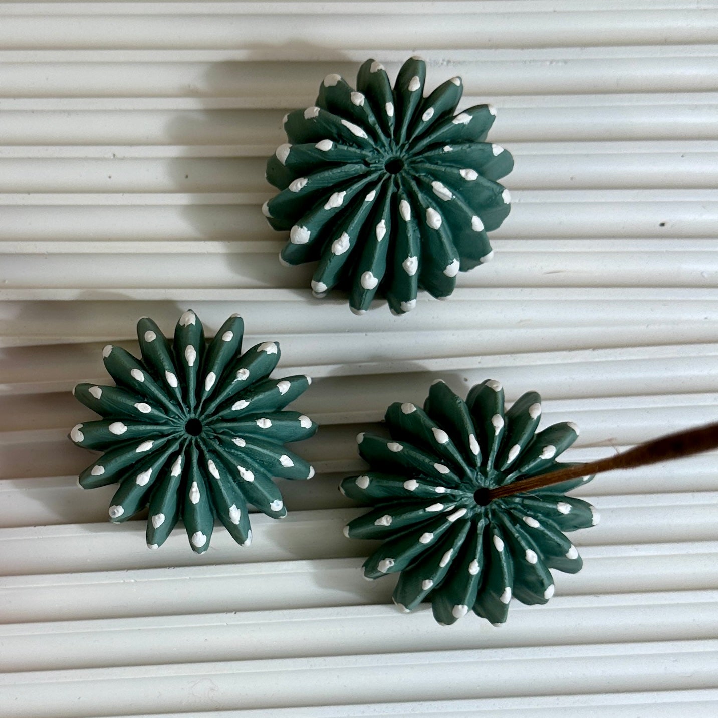 Picture of three domino cactus incense holders on a tray