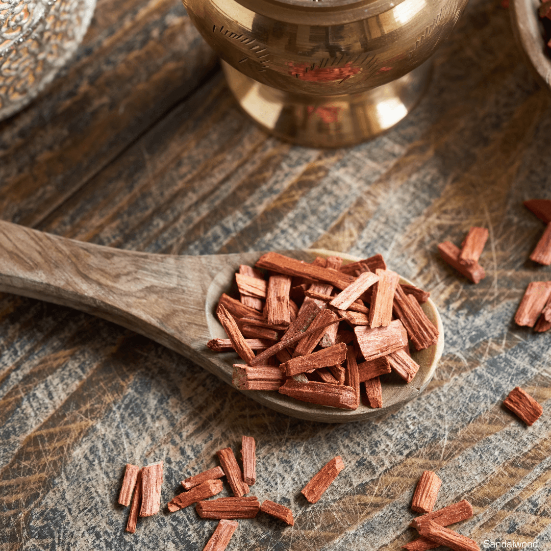 A wooden spoon on a table with wood chips