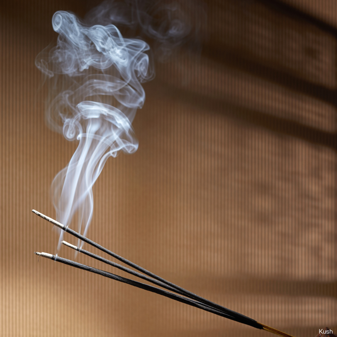 Several Incense sticks Burning with smoke