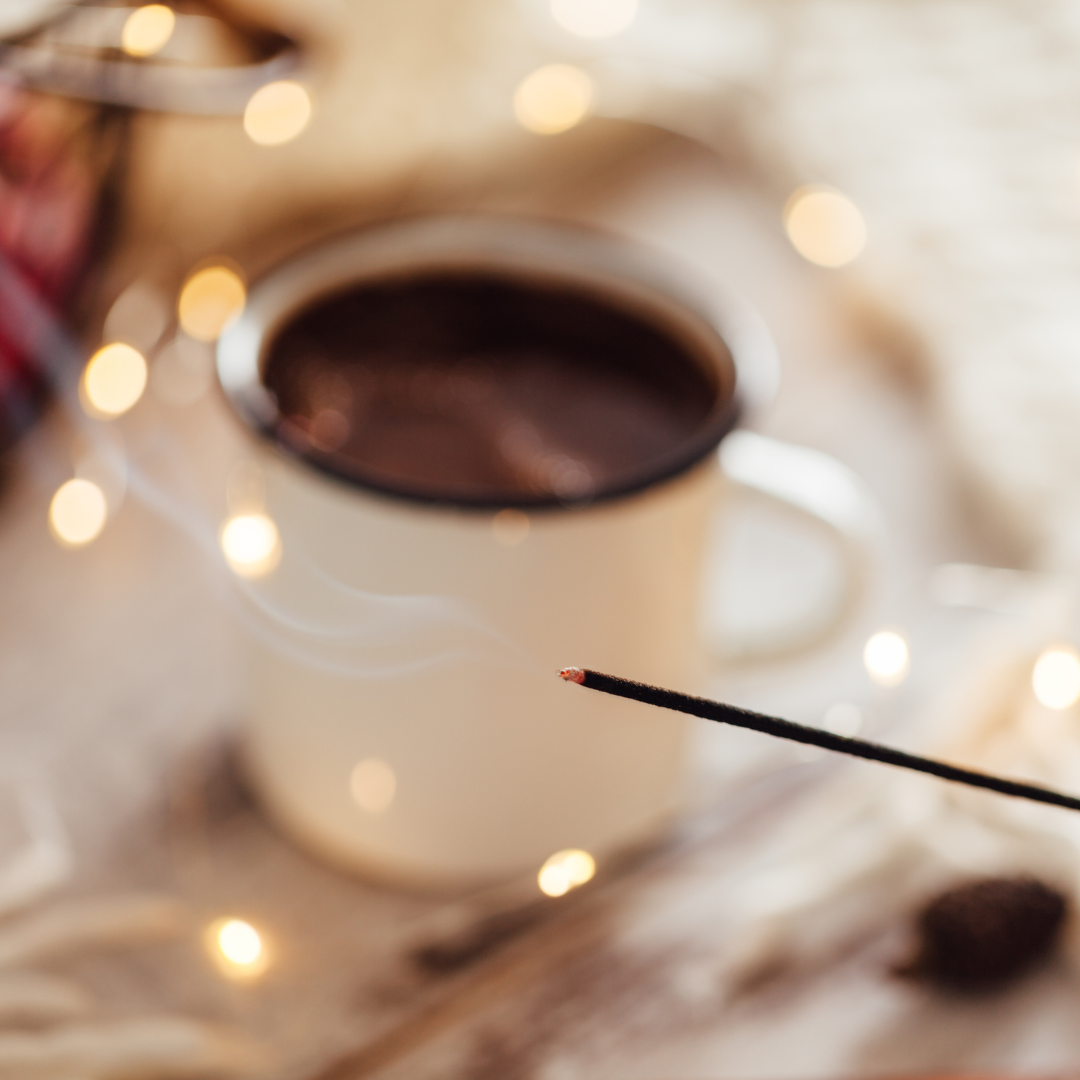 Coffee cup with hot chocolate and a cinnamon stick