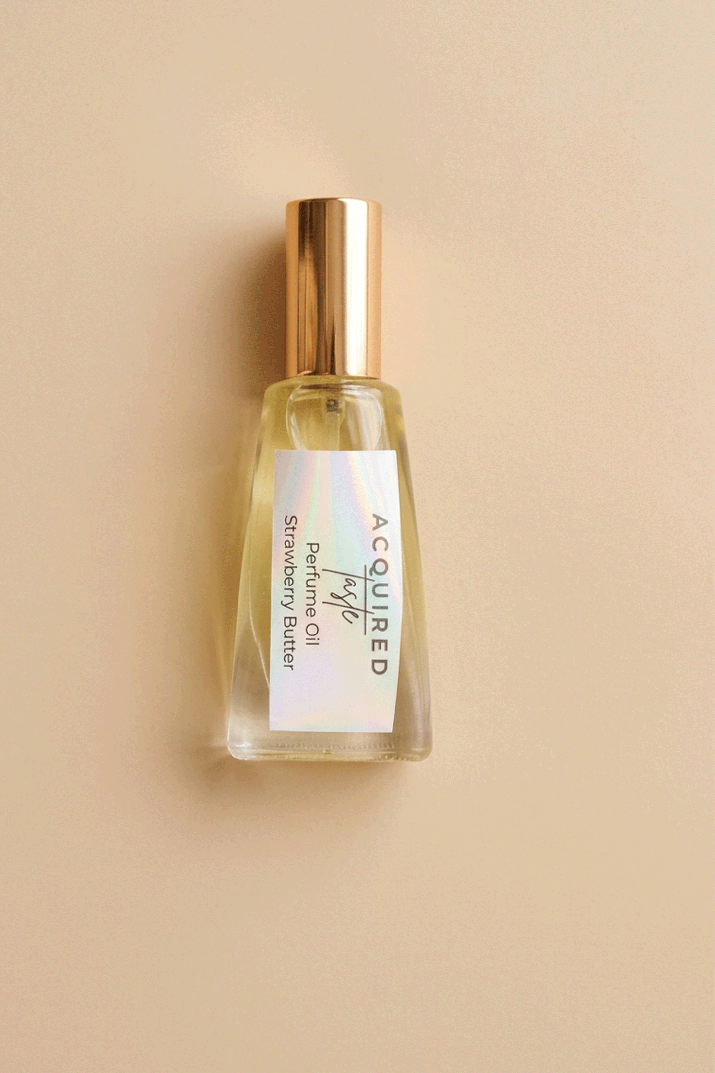 strawberry butter perfume oil on beige background 